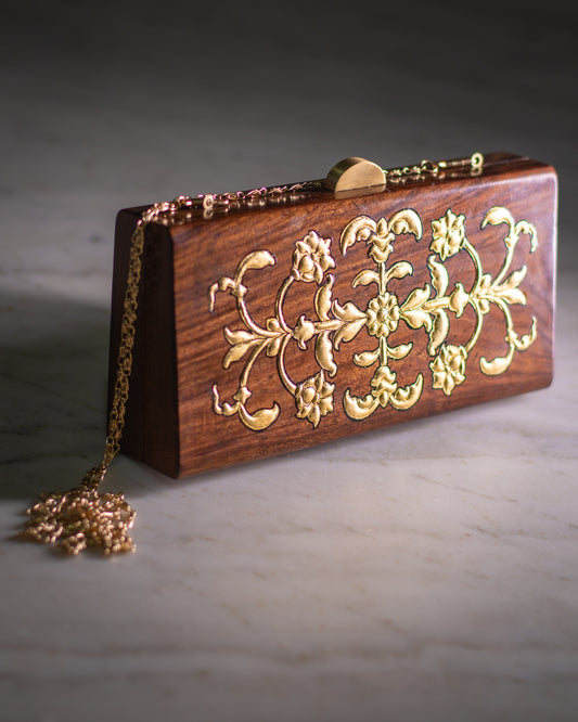 nakshatra wooden clutch with gold trefoil work